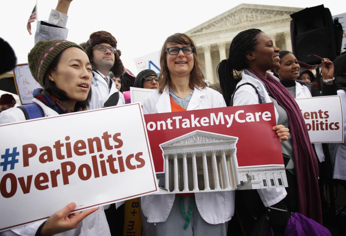 Supporters of the Affordable Care Act gather in front of the U.S Supreme Court in March to urge Justice not to overturn subsisies.