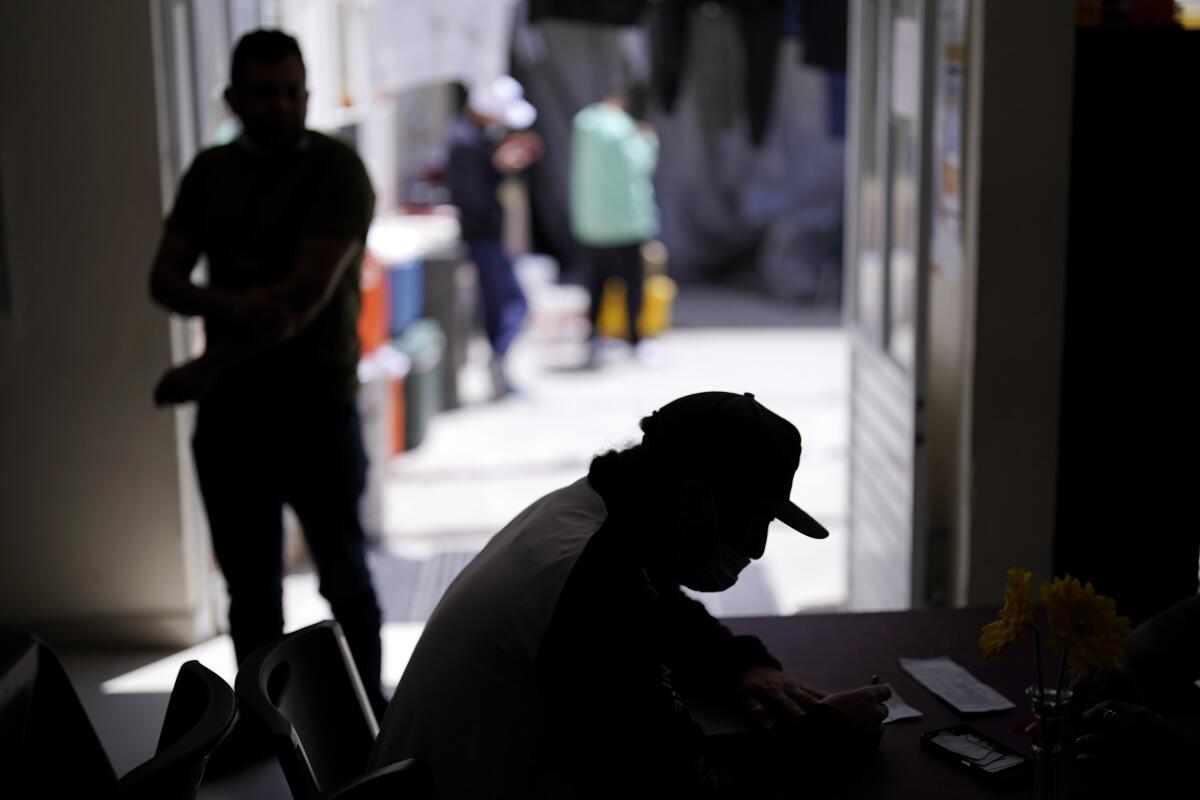 A man from Nicaragua sits at a shelter for migrants.