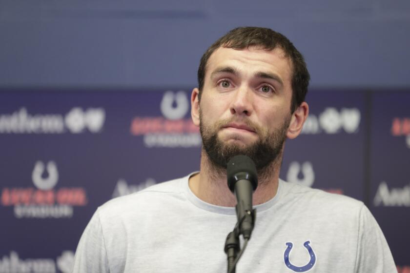 Indianapolis Colts quarterback Andrew Luck speaks during a news conference following an NFL preseason football game against the Chicago Bears, Saturday, Aug. 24, 2019, in Indianapolis. The oft-injured star is retiring at age 29. (AP Photo/Michael Conroy)