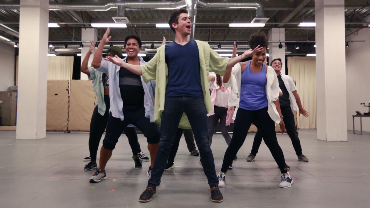 Matt Doyle and fellow cast members rehearse a scene from "The Heart of Rock & Roll" at the Old Globe.