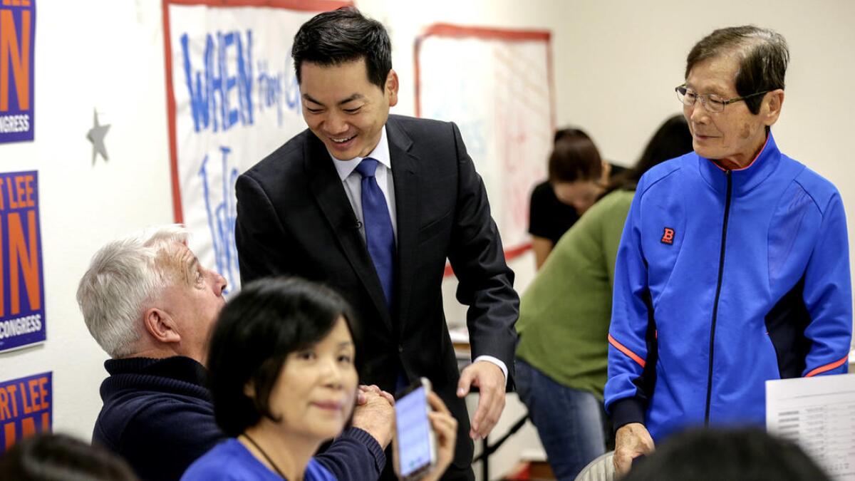 Robert Ahn thanks his staff and volunteers working on election day at his campaign office.