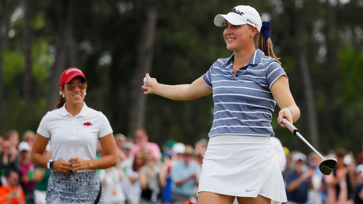 Jennifer Kupcho celebrates on the 18th green after winning the Augusta National Women's Amateur against Maria Fassi (left) at Augusta National Golf Club.