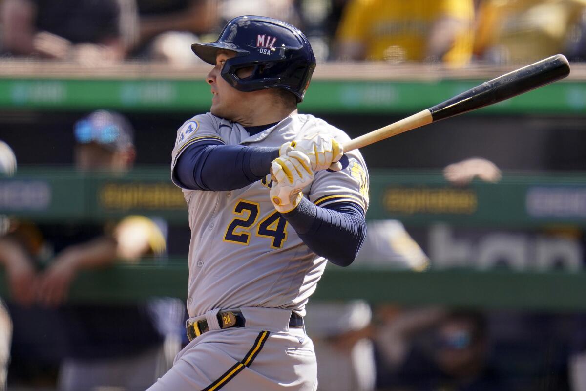 Milwaukee Brewers' Avisail Garcia watches an RBI single off Pittsburgh Pirates starting pitcher Cody Ponce during the second inning of a baseball game in Pittsburgh, Saturday, July 3, 2021. (AP Photo/Gene J. Puskar)