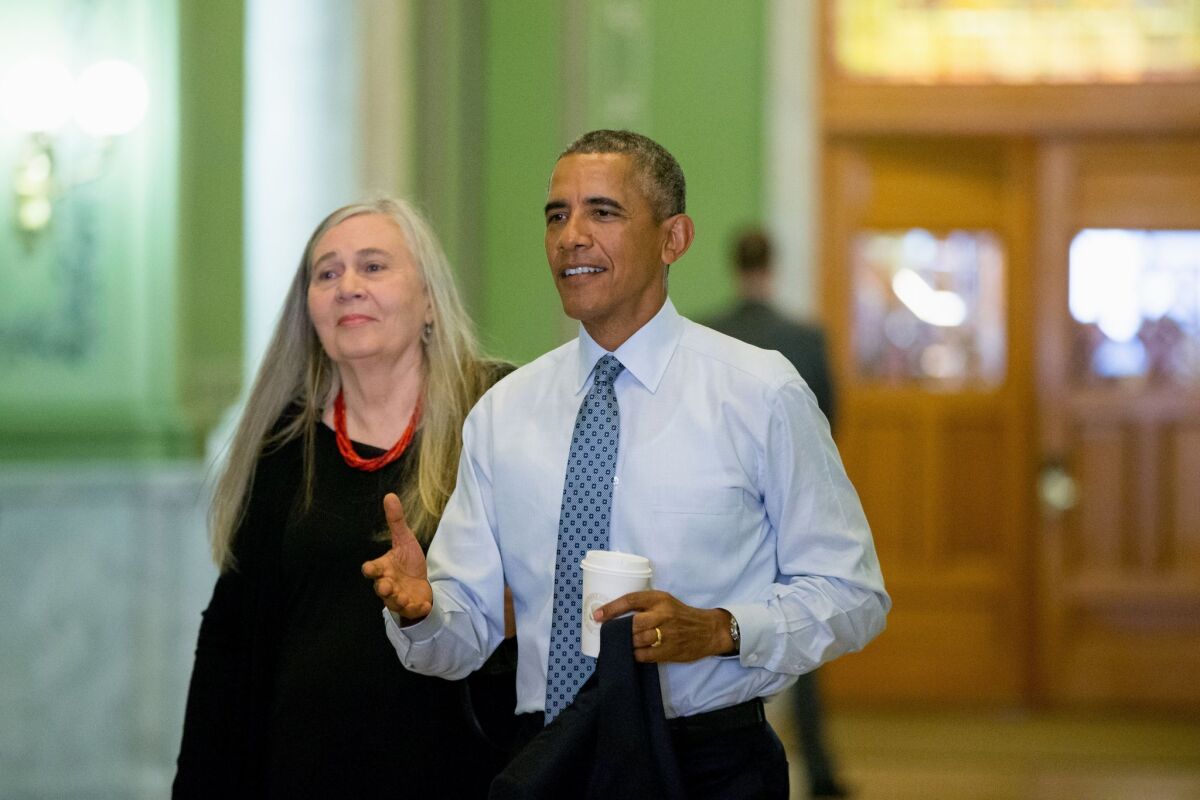 President Obama with author Marilynne Robinson. Obama asked the writer if she thinks Americans don't read enough novels.