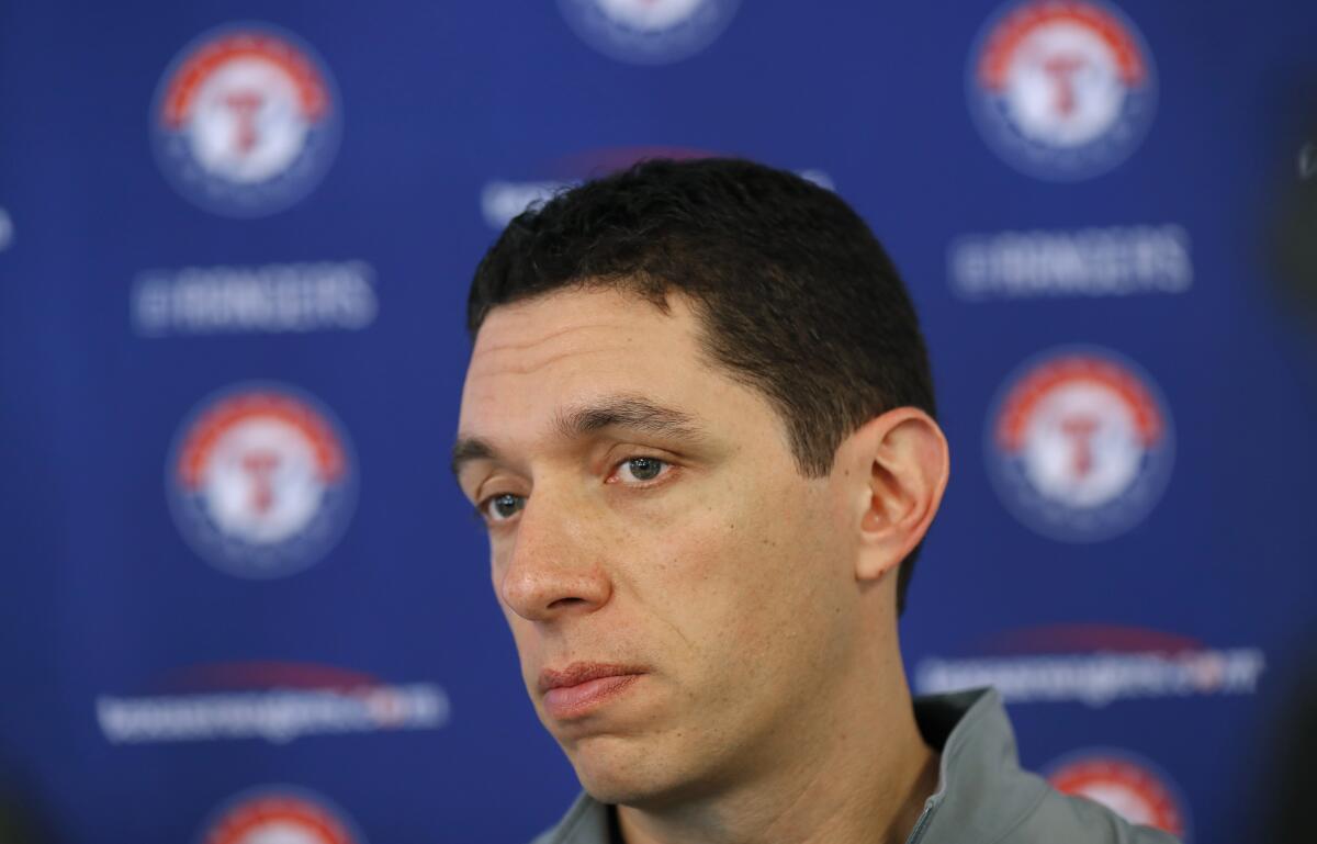 FILE - Texas Rangers general manager Jon Daniels speaks to reporters during baseball spring training in Surprise, Ariz., Feb. 15, 2018. Daniels is out as president of baseball operations for the Texas Rangers after 17 years leading the club. Team owner Ray Davis said Wednesday, Aug. 17, 2022, that Daniels was being relieved of his duties immediately after the decision was made not to renew his contract at the end of the season. (AP Photo/Charlie Neibergall, File)