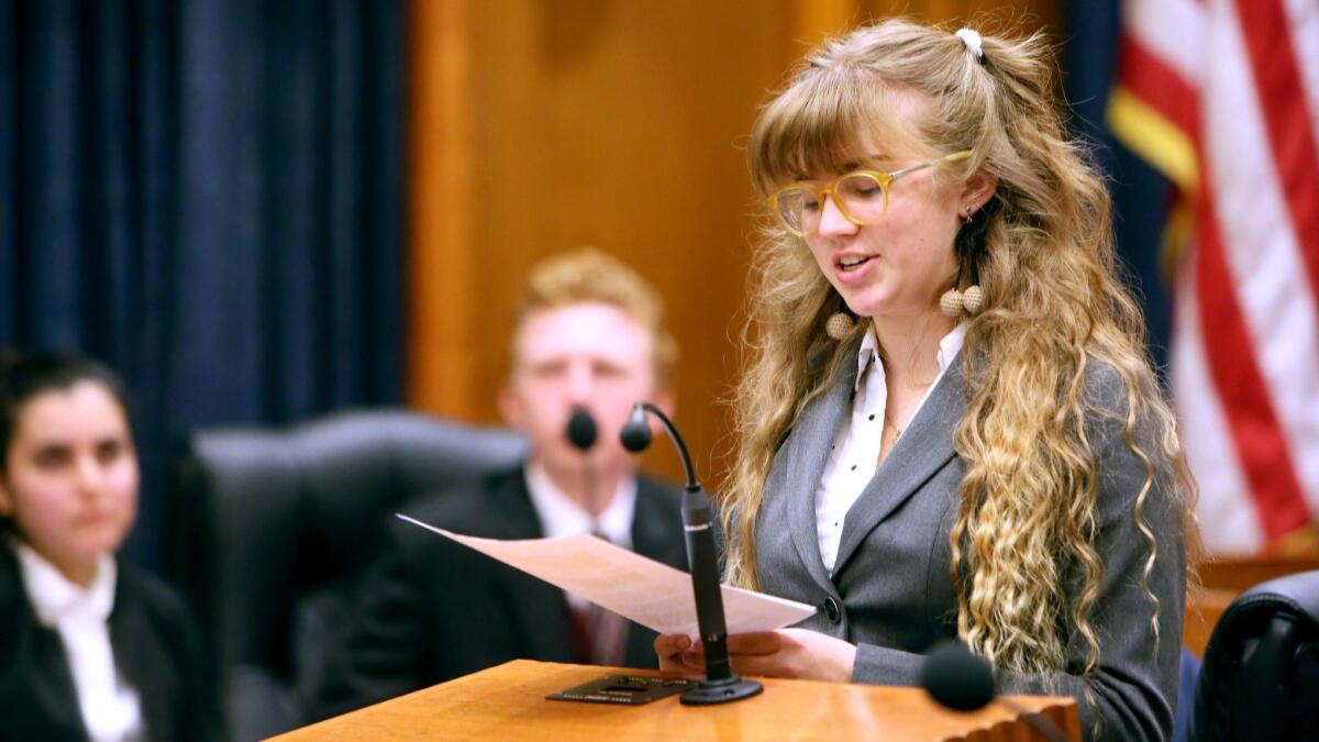 Youth and Government Burbank YMCA Delegation member Phoebe Kellogg presents a bill to make it easier for underage wives to divorce their adult husbands during the bill hearing presentation at the Burbank City Council chambers on Wednesday.