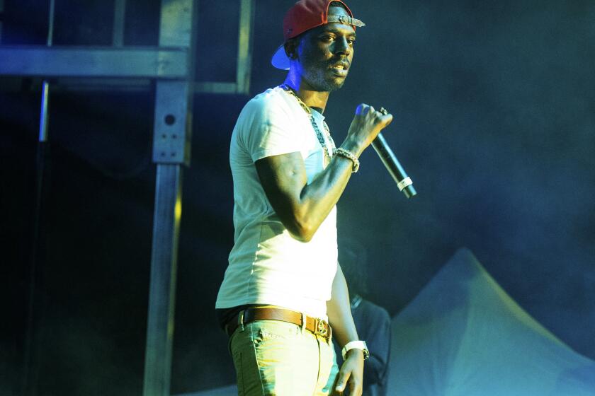 FILE - Young Dolph performs at The Parking Lot Concert in Atlanta on Sunday, Aug. 23, 2020. Officials say rapper Young Dolph has been fatally shot at a cookie shop in his hometown of Memphis, Tennessee, and a search is underway for the shooter. (Photo by Paul R. Giunta/Invision/AP, File)