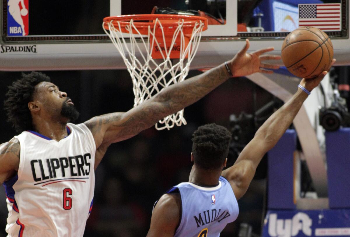 Denver Nuggets guard Emmanuel Mudiay, right, shoots against Los Angeles Clippers center DeAndre Jordan during the first half on Wednesday.