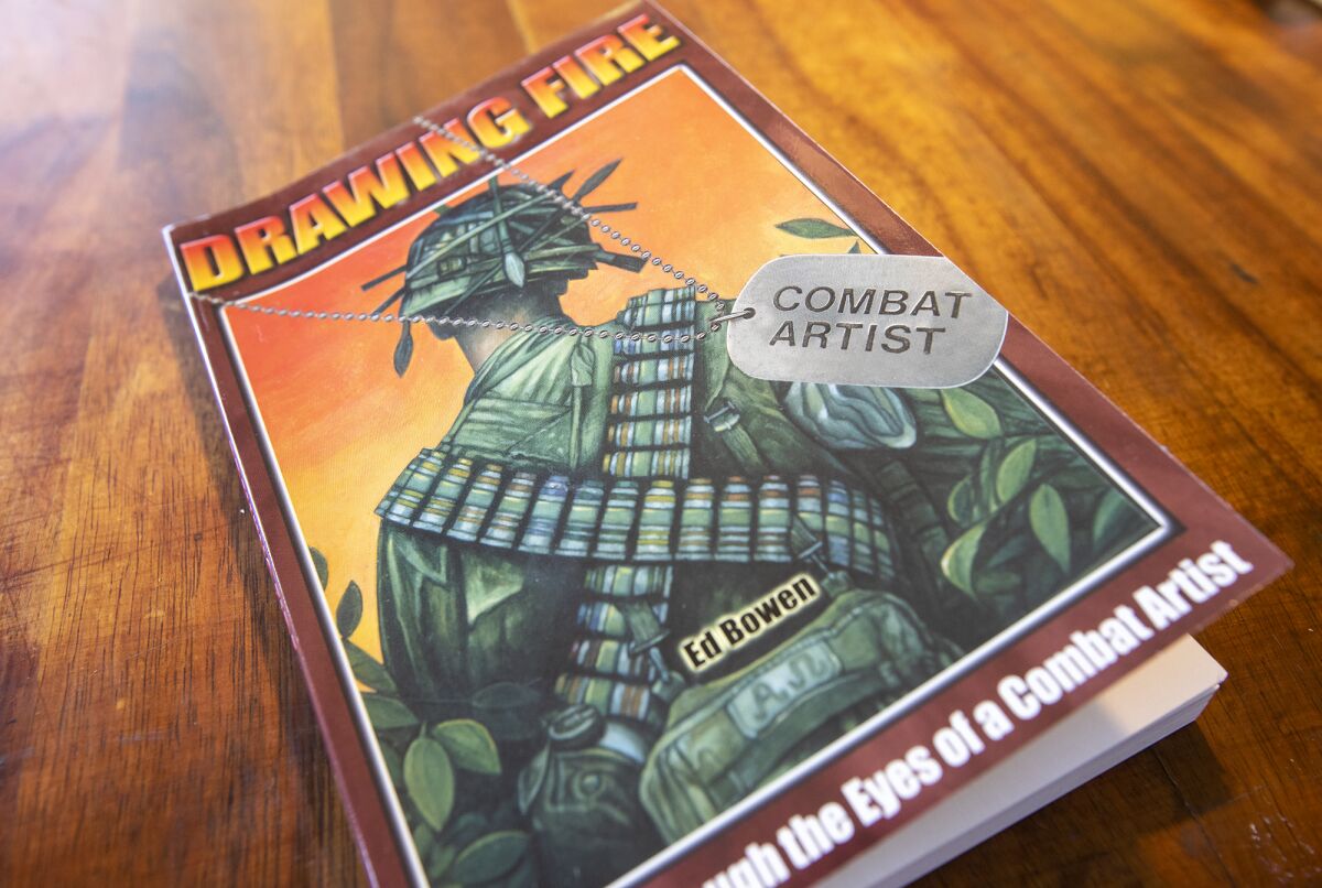 A copy of the book "Drawing Fire: Vietnam Through the Eyes of a Combat Artist."