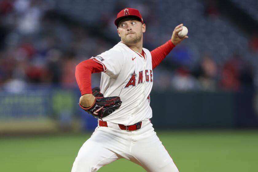 Los Angeles Angels starting pitcher Reid Detmers throws during the first inning.