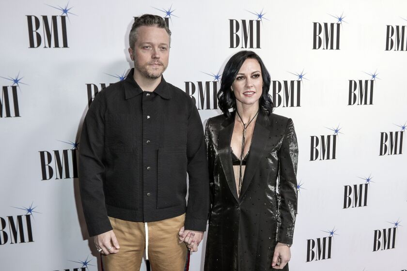 FILE - Jason Isbell, left, and Amanda Shires arrive at 67th Annual BMI Country Awards ceremony on Nov. 12, 2019, in Nashville, Tenn. (Photo by Al Wagner/Invision/AP, File)