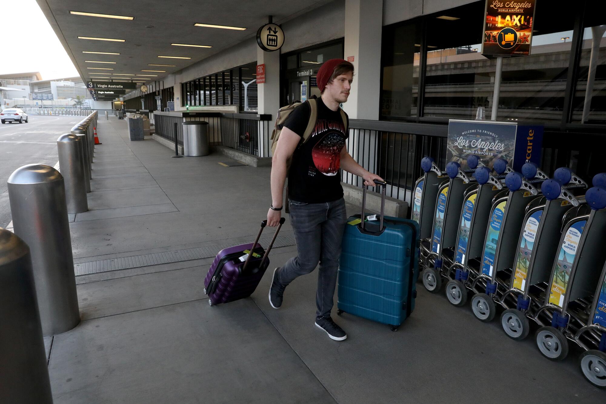Isaac Stevens of Myrtle Beach, S.C., makes his way to his connecting flight at LAX. 