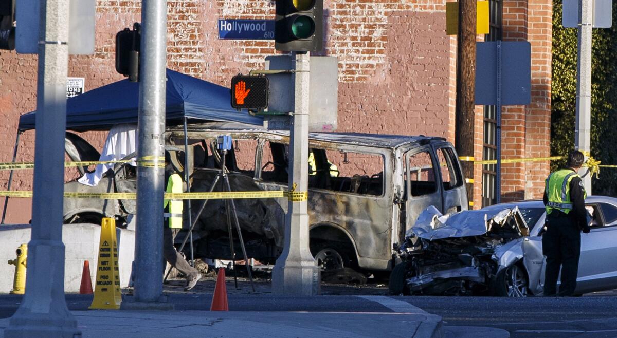 L.A. police officers investigate the scene of a fatal car accident at Hollywood Boulevard and Gower Street.