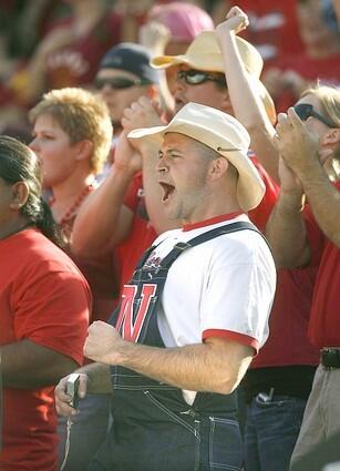 Nebraska fan Joe Connolley, of Santa Clarita cheers for his team at the Coliseum.