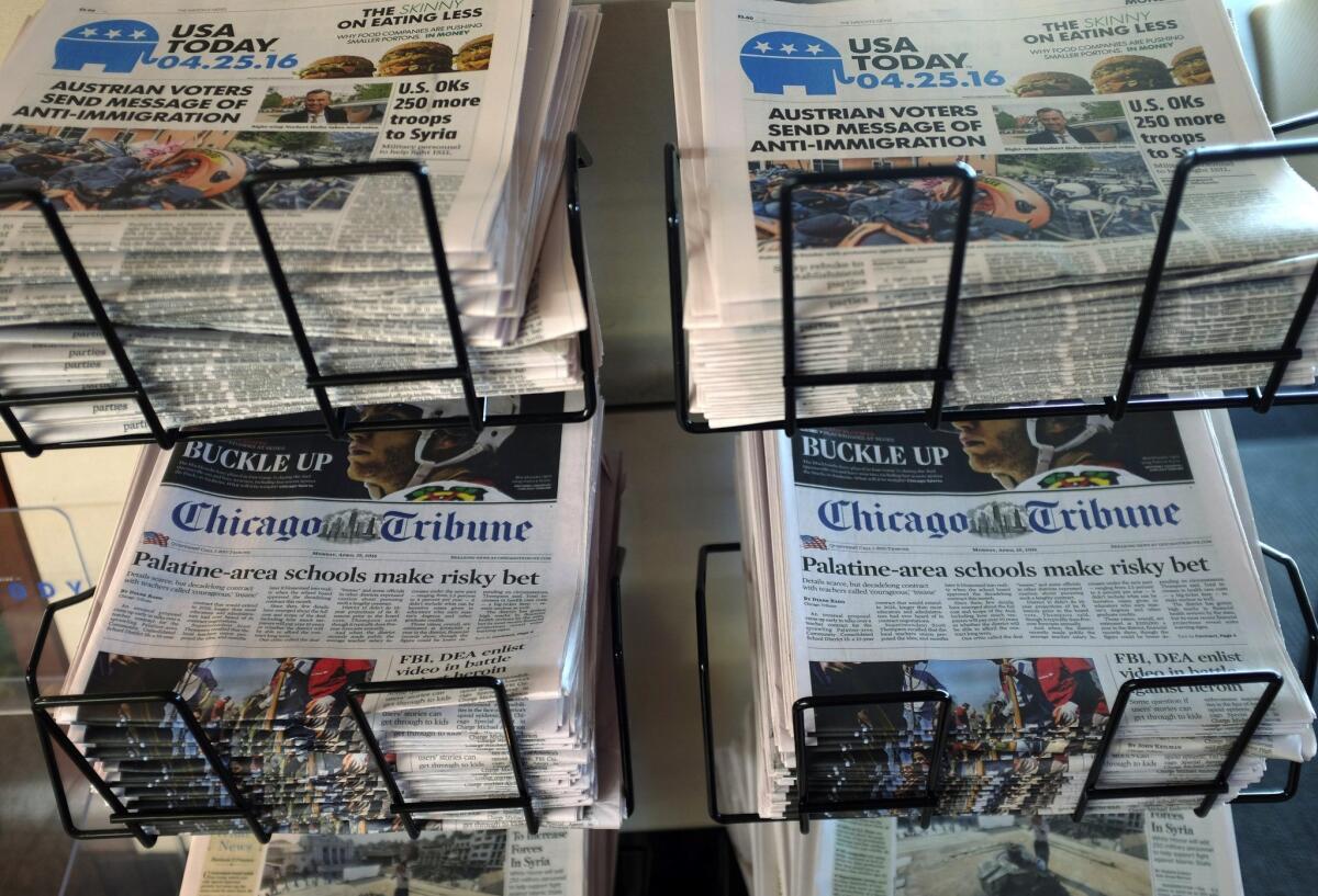 USA Today, Chicago Tribune and other newspapers are displayed at Chicago's O'Hare International Airport in April.
