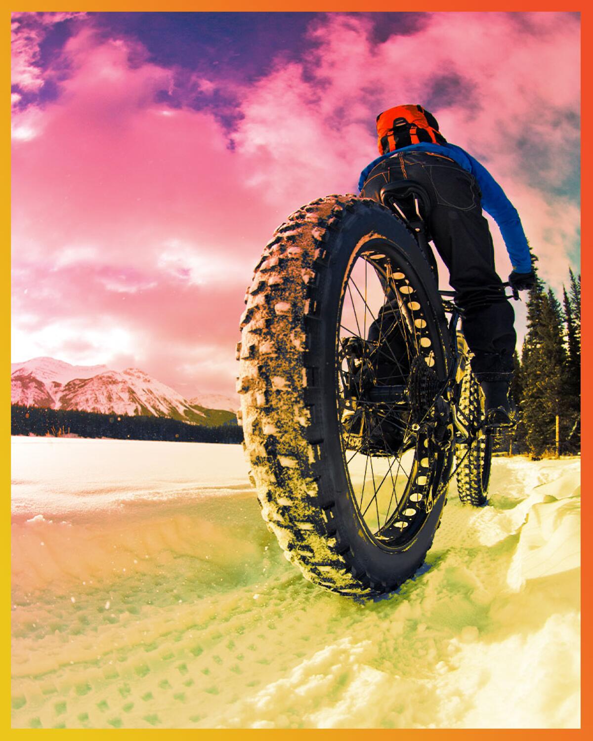 View of a young man on a winter fat-bike ride.