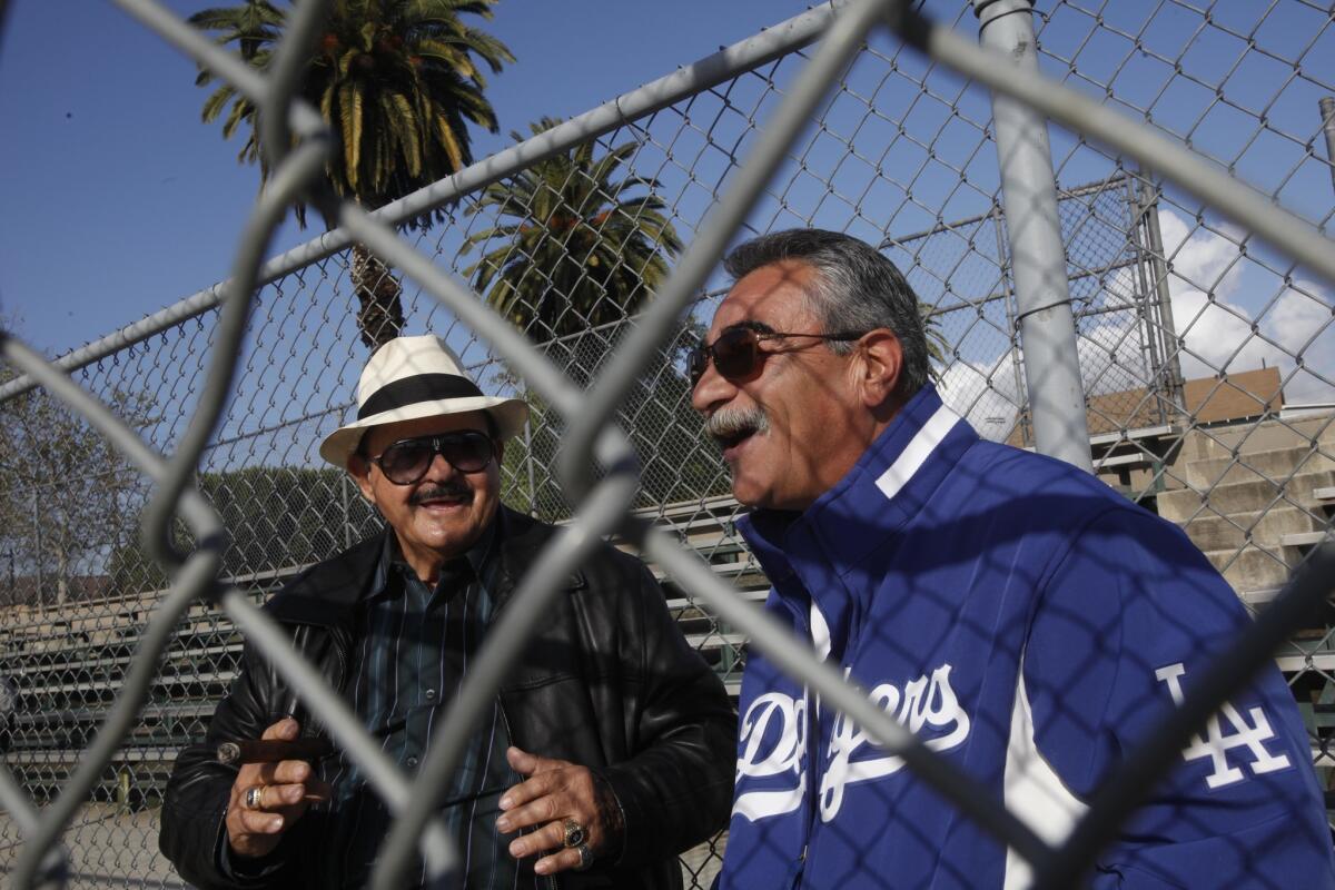 Mike Brito, left, and Bobby Castillo talk about the good old days in the Dodgers organization at the Evergreen Recreation Center on Tuesday morning. Brito signed Castillo, a former Dodgers pitcher who taught Fernando Valenzuela the screwball, his most lethal pitch.
