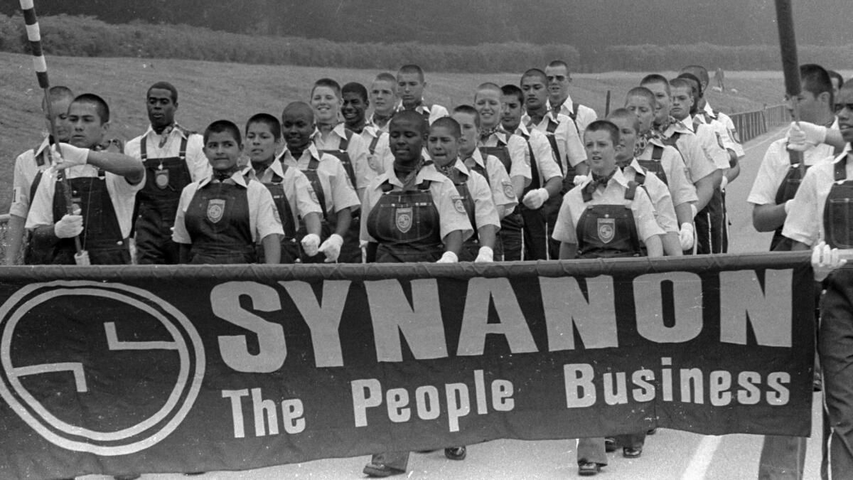 Punk Squad marching with a Synanon banner
