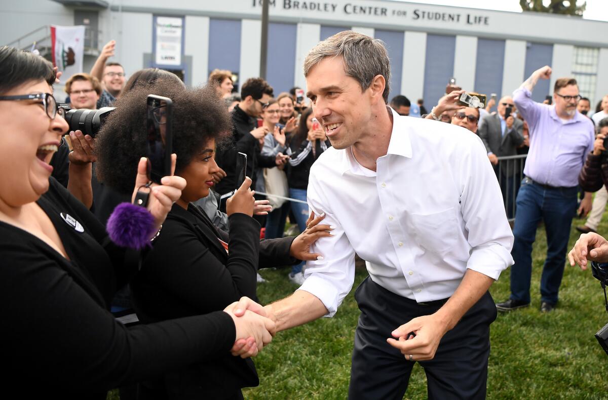 Beto O'Rouke greets supporters as he arrives for a rally at Los Angeles Trade-Technical College.