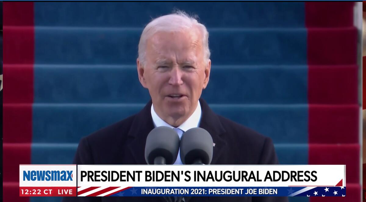 Biden speaks into microphones in a still from the Newsmax broadcast of his inaugural address