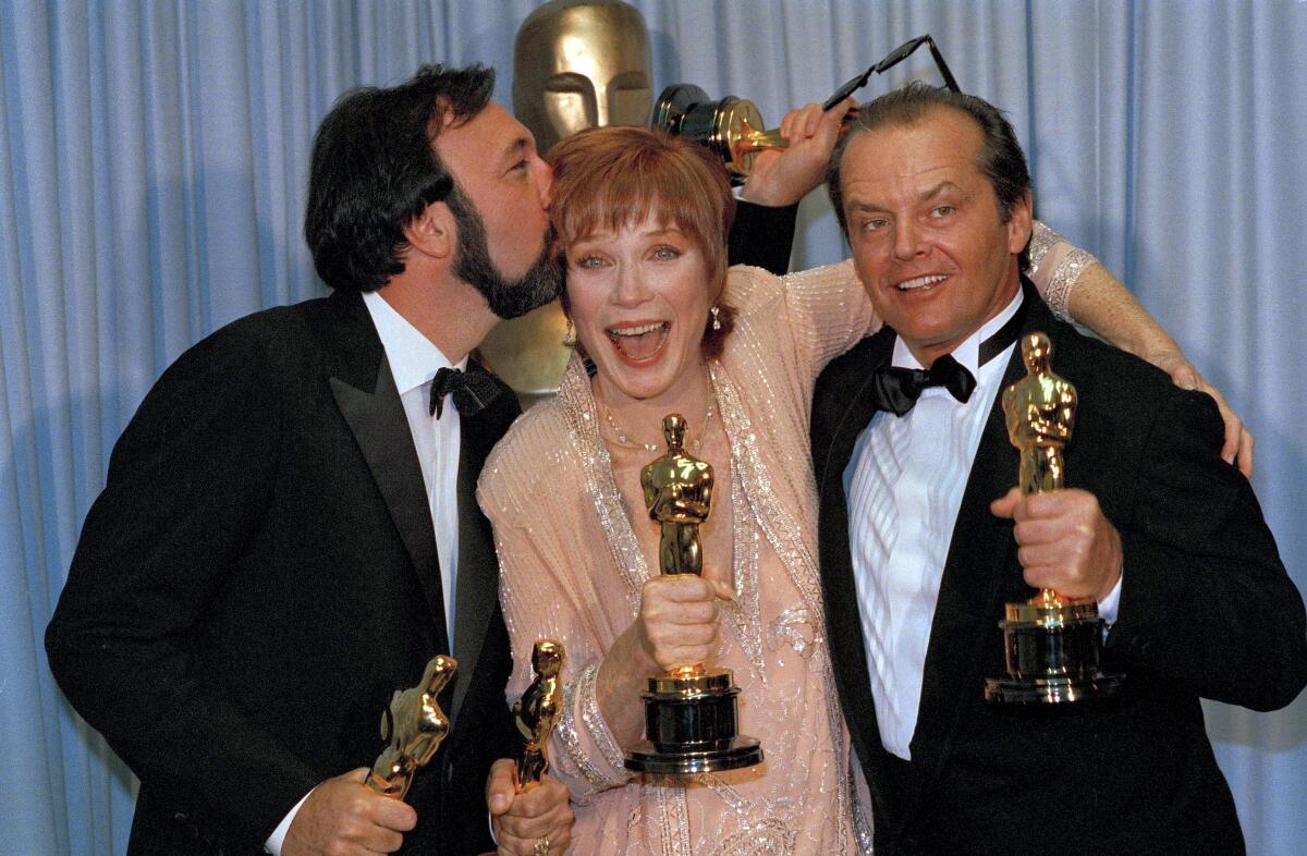 Three Oscar winners celebrate.