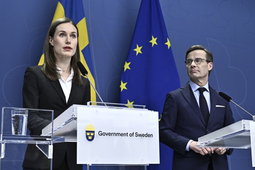 Finland's Prime Minister Sanna Marin, left, and Sweden's Prime Minister Ulf Kristersson attend a joint news conference at the government headquarters Rosenbad in Stockholm, Sweden, Thursday Feb. 2, 2023. (Jonas Ekstromer/TT News Agency via AP)
