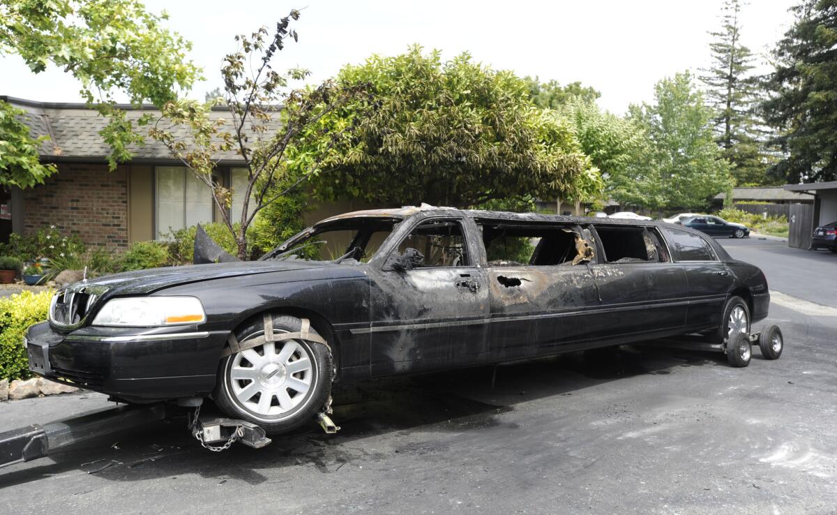 A burned-out 2009 Lincoln Town Car limousine sits in a driveway along Skycrest Drive in the Rossmoor community of Walnut Creek. Ten women heading to a birthday party escaped unharmed when the limousine burst into flames.