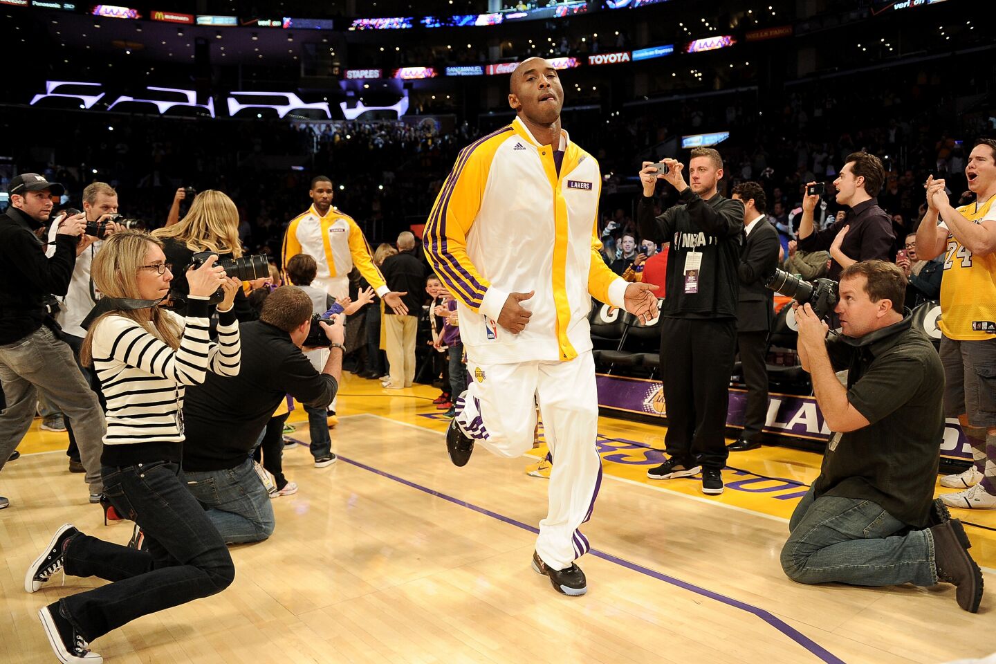 Kobe Bryant warms up during his first game after tearing his Achilles.