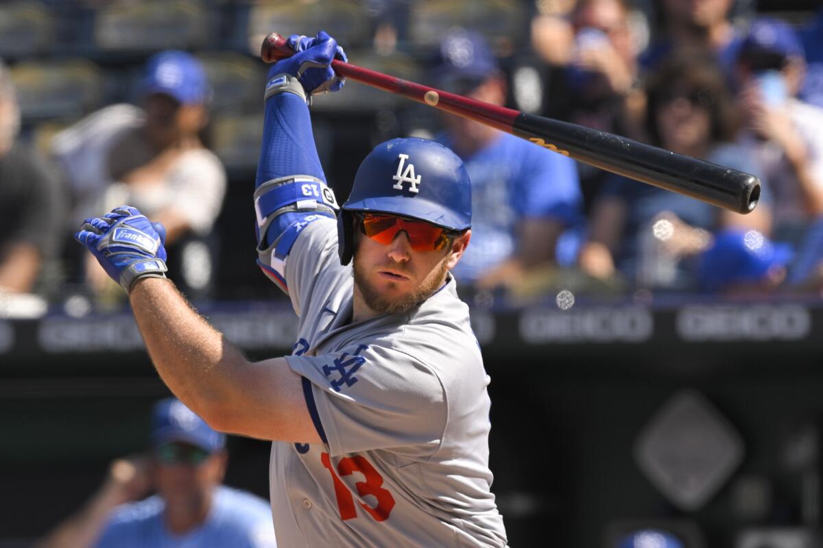 The Dodgers' Max Muncy follows through on a swing against the Kansas City Royals on Aug. 14