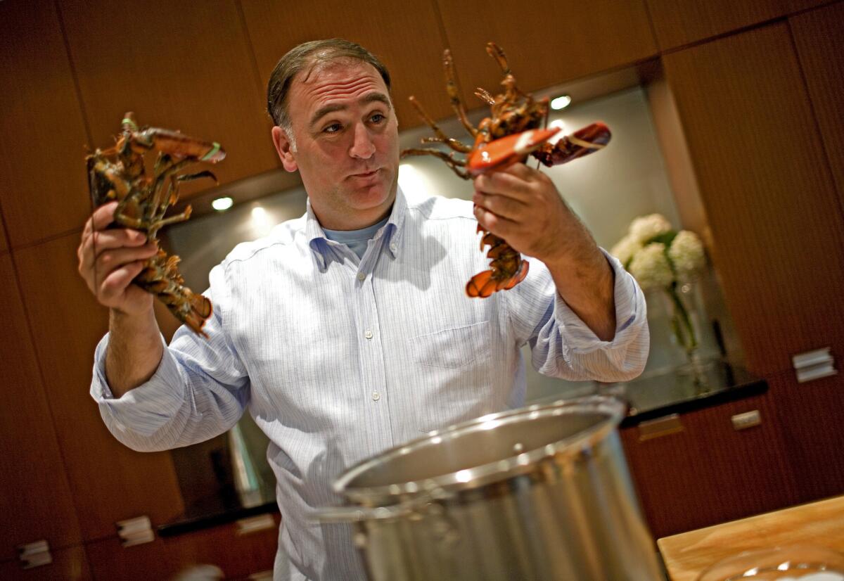Freelance chef Jose Andres prepares to kiss lobsters before they go into the pot for his lobster and potatoes dish in his home in Bethesda, MD, in 2008.