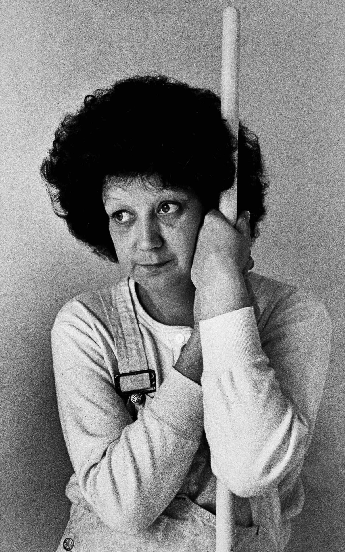 Norma McCorvey, 35, the Dallas mother whose desire to have an abortion was the basis for a landmark Supreme Court decision a decade ago, takes time from her job as a house painter to pose for a photograph in Terrell, Texas, on Thursday, Jan. 21, 1983. To legal scholars, she is simply "Jane Roe."