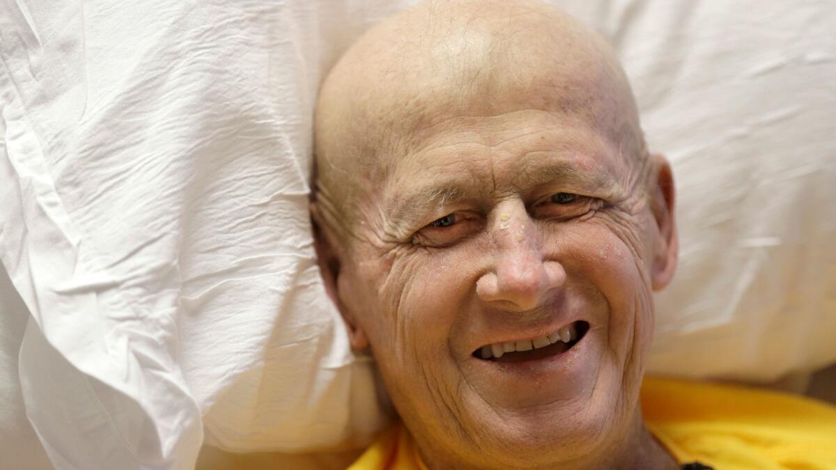 Sportscaster Craig Sager smiles from a hospital bed in Houston on Aug. 30, the day before undergoing his third bone marrow transplant to treat leukemia.