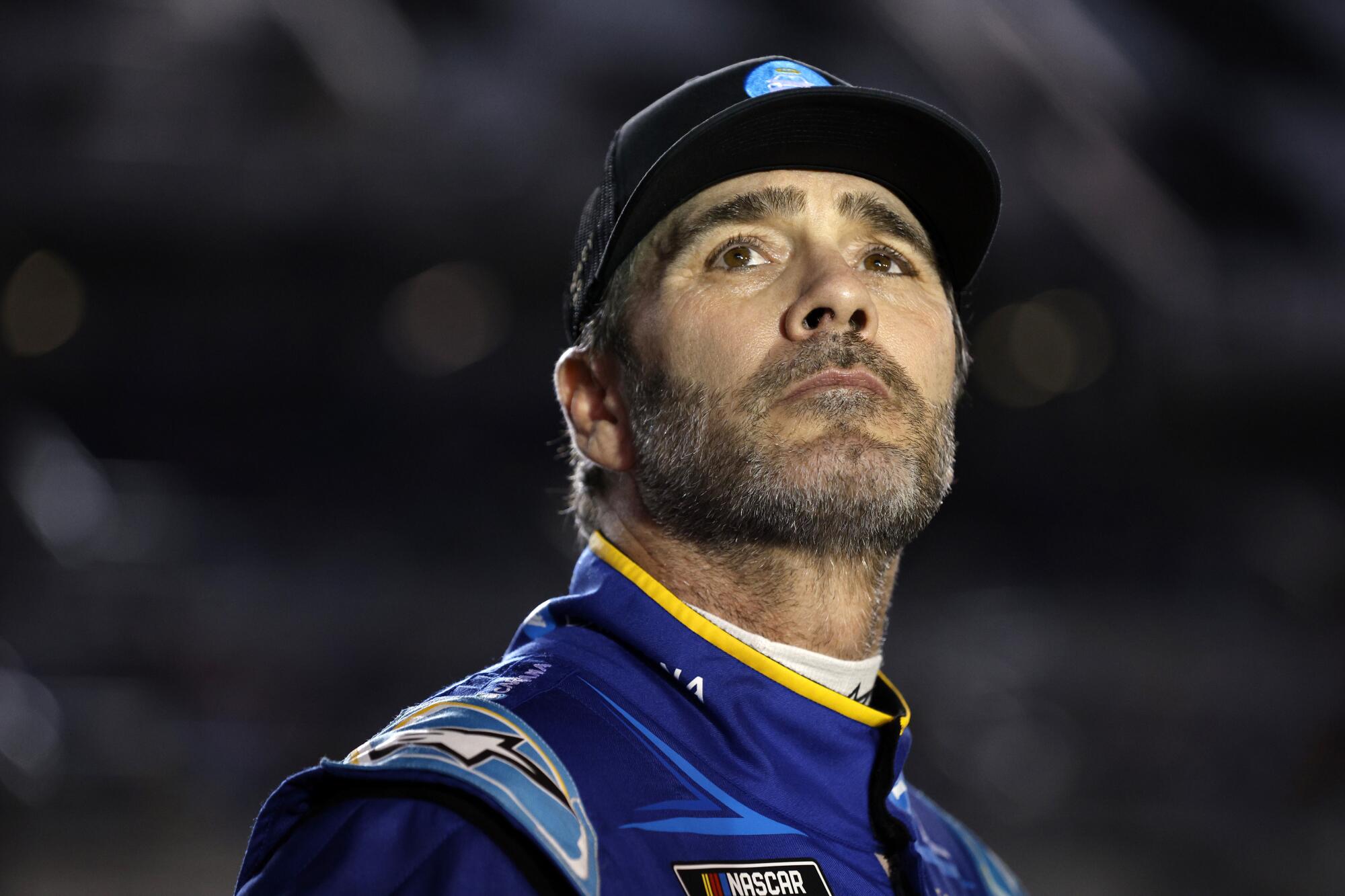 Jimmie Johnson looks up into the stands at Daytona International Raceway.