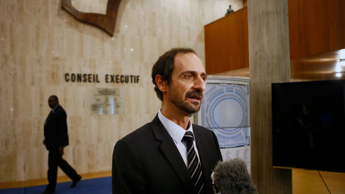 Palestinian deputy ambassador to UNESCO Mounir Anastas, speaks to the media as he walks out of the meeting room at UNESCO's headquarters in Paris on Monday.