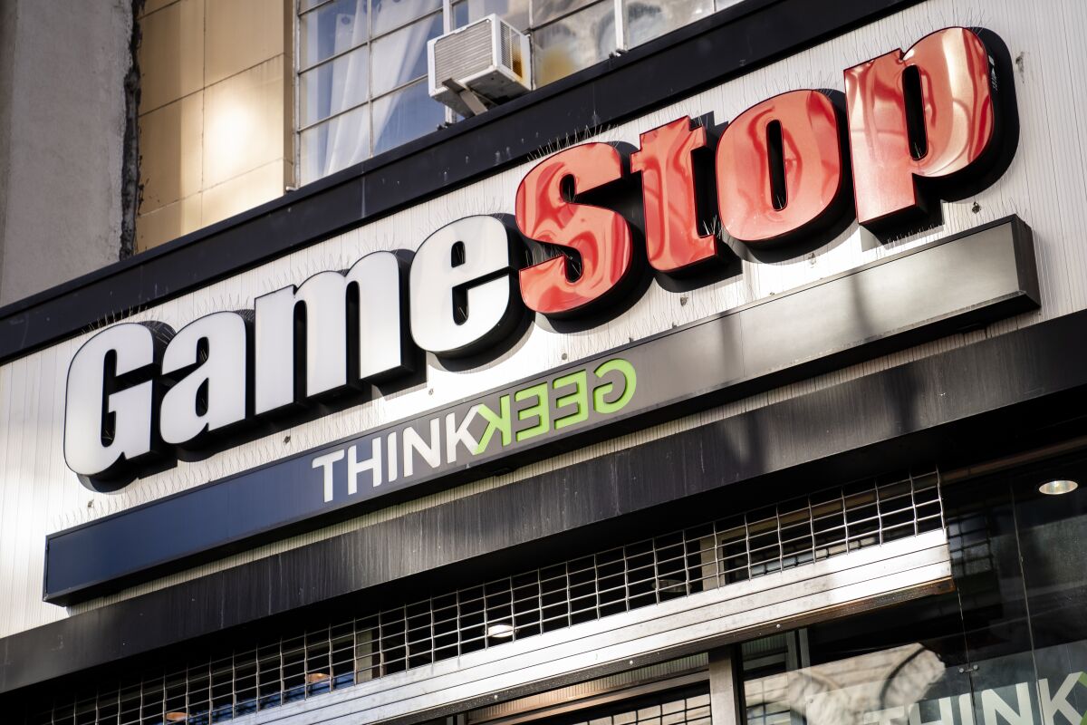 FILE - This Jan. 28, 2021, file photo, shows a GameStop store in New York. GameStop, the video-game retailer whose manic stock movements captivated Wall Street this year, said Wednesday, June 9, 2021, it’s brought on a pair of Amazon veterans as its new chief executive and chief financial officer to aid in its much anticipated digital turnaround. (AP Photo/John Minchillo, File)