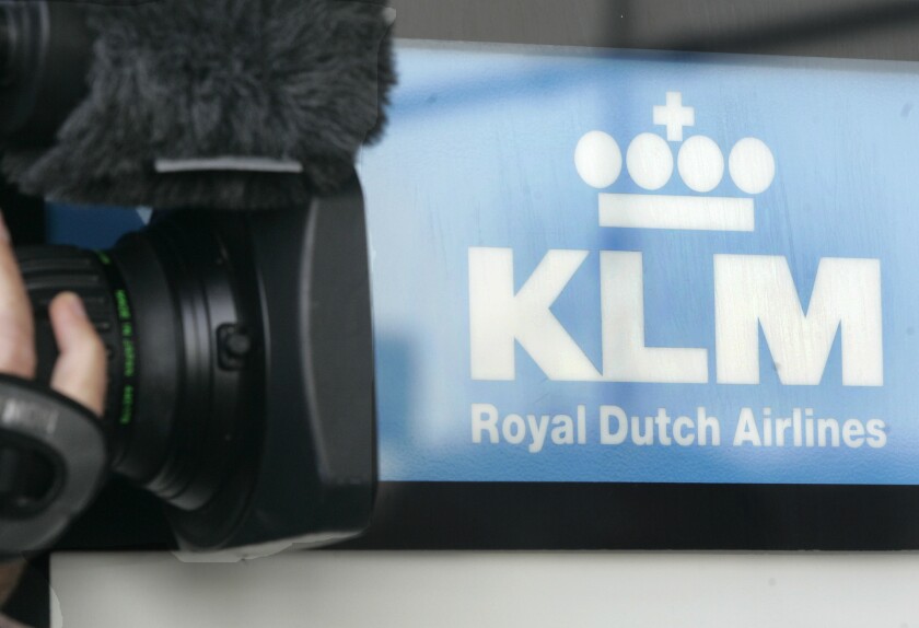 FILE - A cameraman films the Logo of Dutch airline KLM at the Cologne Bonn Airport in Cologne, western Germany, Sept. 26, 2008. Dutch flag carrier KLM announced Thursday, June 30, 2022 it is repaying the last portion of loans from the Netherlands government and banks to help it survive when the COVID-19 pandemic threw global aviation into a tailspin. (AP Photo/Roberto Pfeil, file)