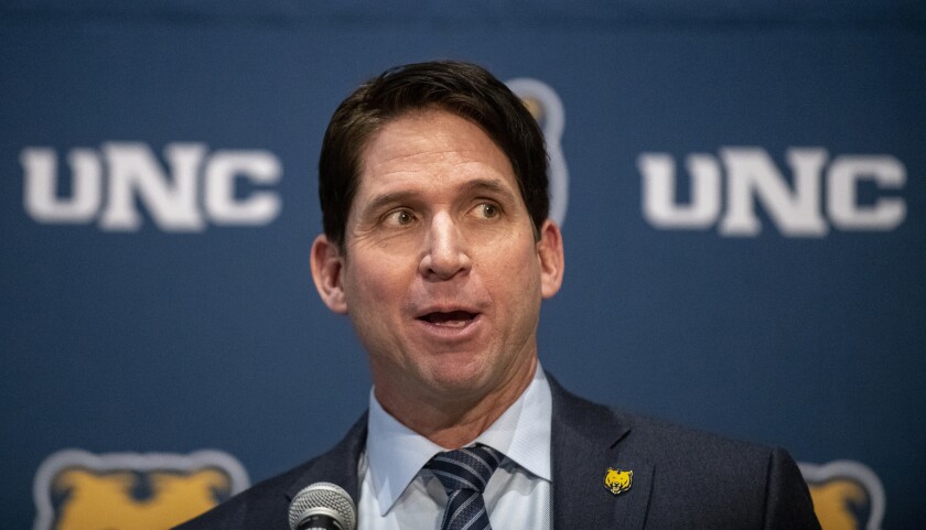 FILE - Ed McCaffrey speaks during a press conference introducing the retired Denver Broncos wide receiver as the new University of Northern Colorado NCAA college football head coach in the Campus Commons on the UNC campus in Greeley, Colo., in this file photograph taken Friday, Dec. 13, 2019. McCaffrey's son, Dylan, who has been playing at the University of Michigan, will be joining his father in Greeley to play for Northern Colorado. (Alex McIntyre/The Greeley Tribune via AP, File)