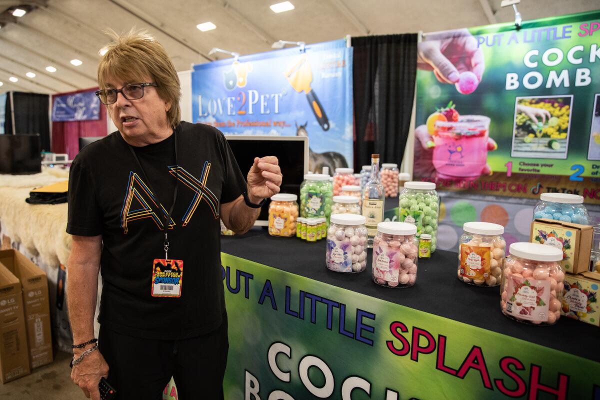 Randal Finn, U.S. executive distributor for Cocktail Bomb Shop, explains his product at San Diego County Fair on Wednesday.