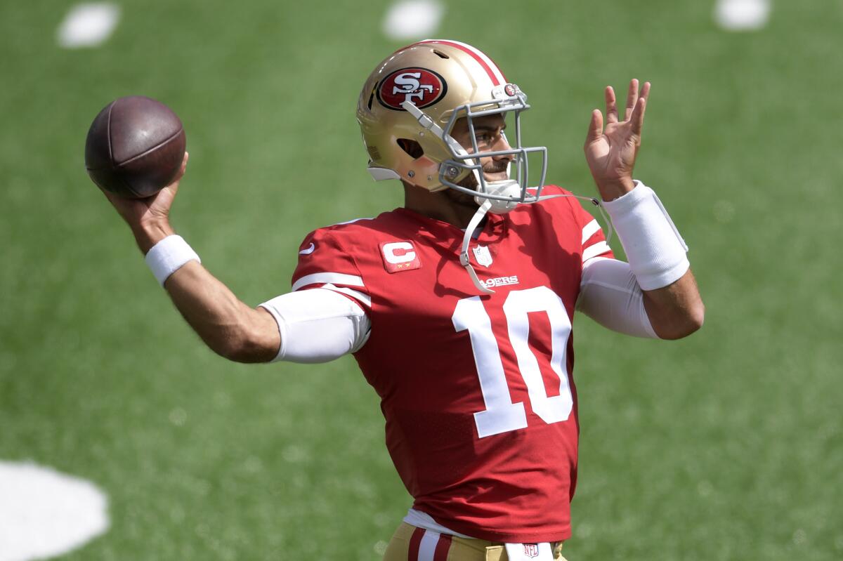 San Francisco quarterback Jimmy Garoppolo warms up with some throwing before a game.