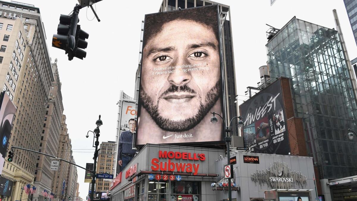 A Nike ad featuring former NFL quarterback Colin Kaepernick is shown in New York.