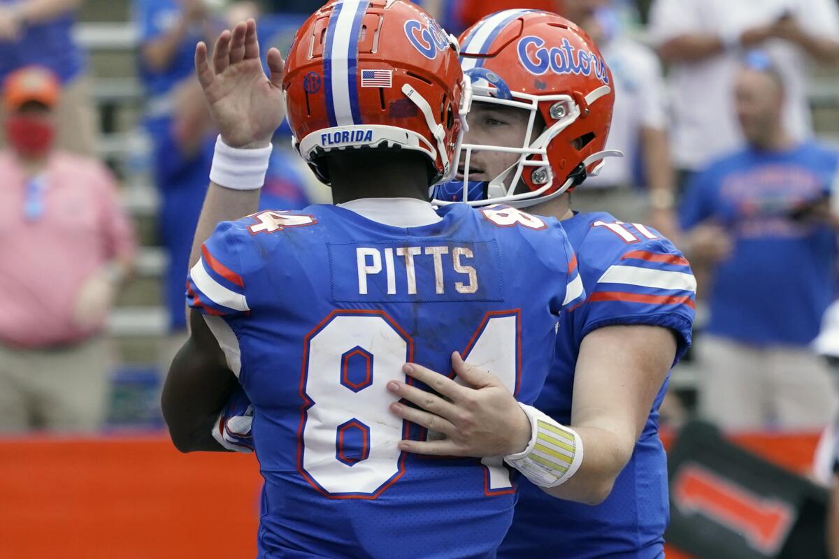 Florida tight end Kyle Pitts celebrates a touchdown reception with quarterback Kyle Trask on Nov. 28, 2020.