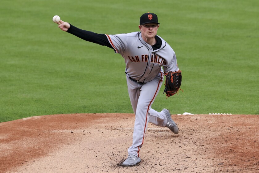 San Francisco Giants' Logan Webb throws during the first inning of a baseball game against the Cincinnati Reds in Cincinnati, Monday, May 17, 2021. (AP Photo/Aaron Doster)