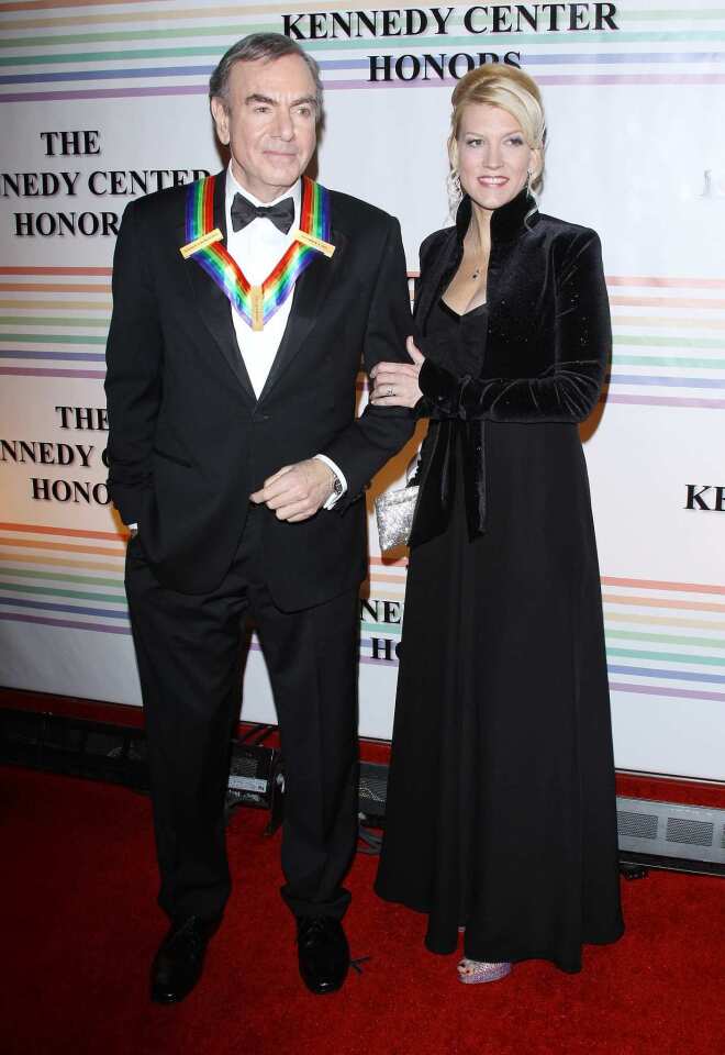 Musician Neil Diamond arrives at the 34th Kennedy Center Honors with his fiancee, Katie McNeil.