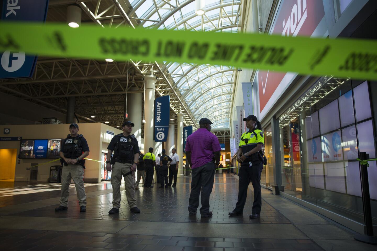 Police and emergency responders stand outside a McDonald's located inside Union Station in Washington, Friday, Sept. 11, 2015.