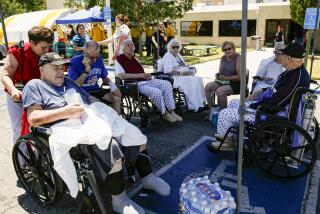 RIDGECREST, CA - JULY 04, 2019 ? Evacuated patients rest under a shade of tent after being evacuated from Ridgecrest Regional Hospital after city was hit by a 6.4 earthquake Thursday July 04, 2019 morning. (Irfan Khan / Los Angeles Times)