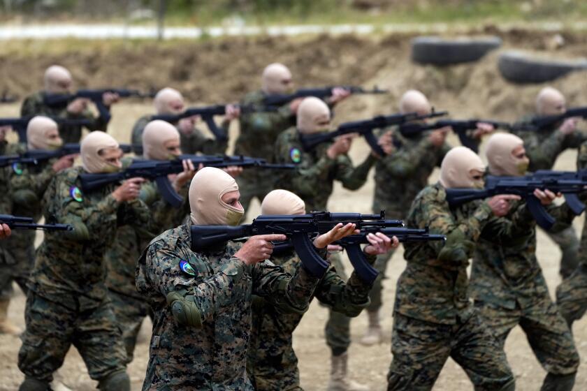 FILE - Fighters from the Lebanese militant group Hezbollah carry out a training exercise in Aaramta village in the Jezzine District, southern Lebanon, Sunday, May 21, 2023. (AP Photo/Hassan Ammar, File)