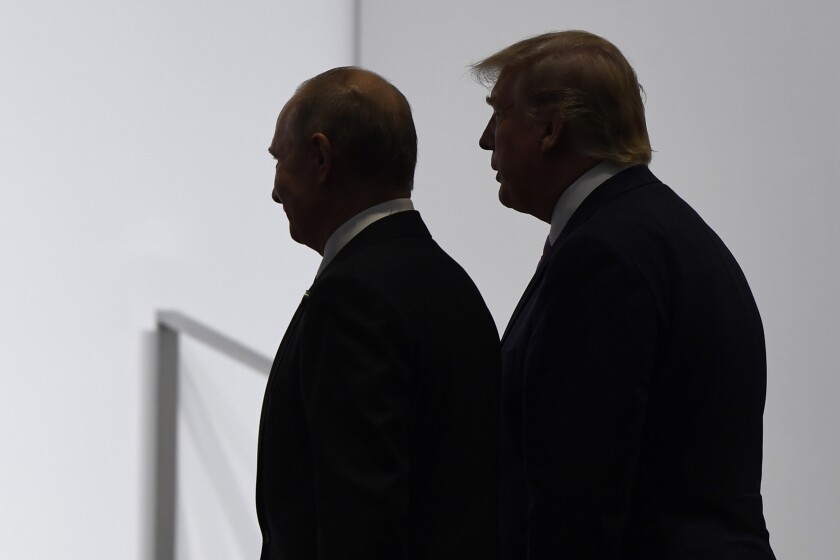 Then-President Trump and Russian President Vladimir Putin walk together