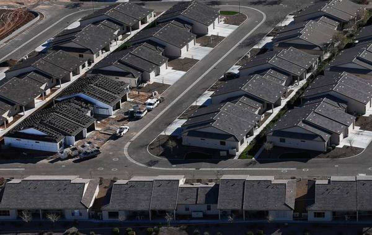 The FHA, which propped up the housing markets after the financial crisis and wound up requiring a $1.7 billion bailout, now says its finances are improving. Above, homes under construction this year in Mesa, Ariz.