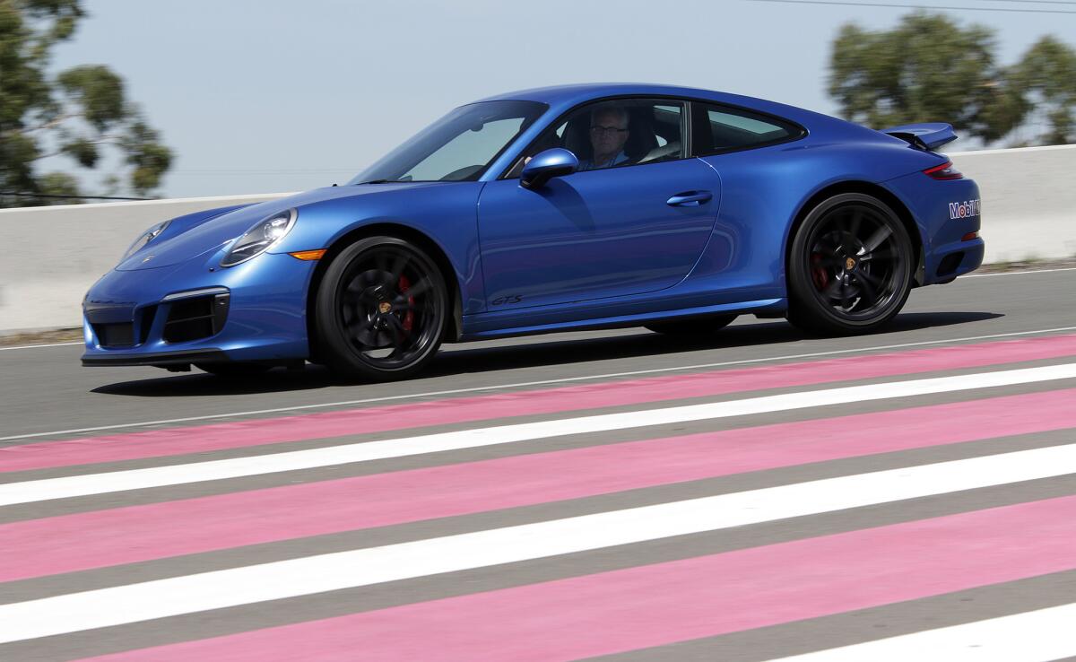 Los Angeles Times reporter Russ Mitchell negotiates the Handling Circuit in a Porsche 911 Carrera GTS at the Porsche Experience Center in Carson.