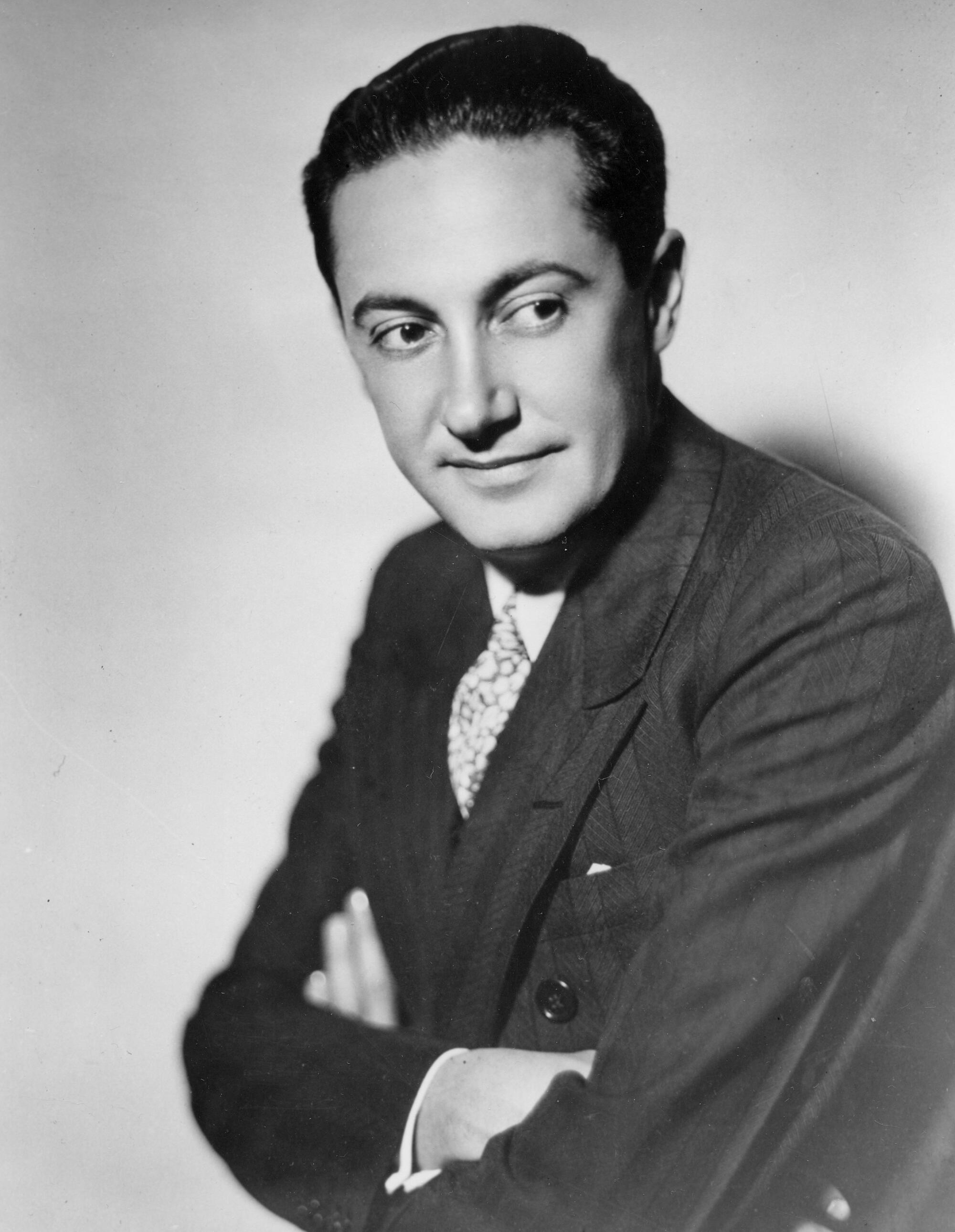 Irving Thalberg with his arms crossed